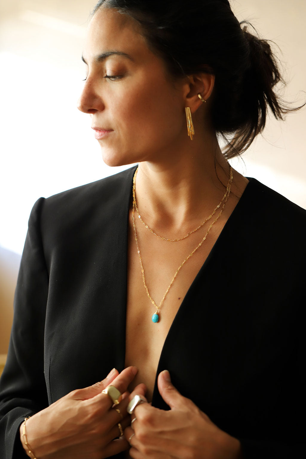 neckline with delicate long and short double strand turquoise necklace