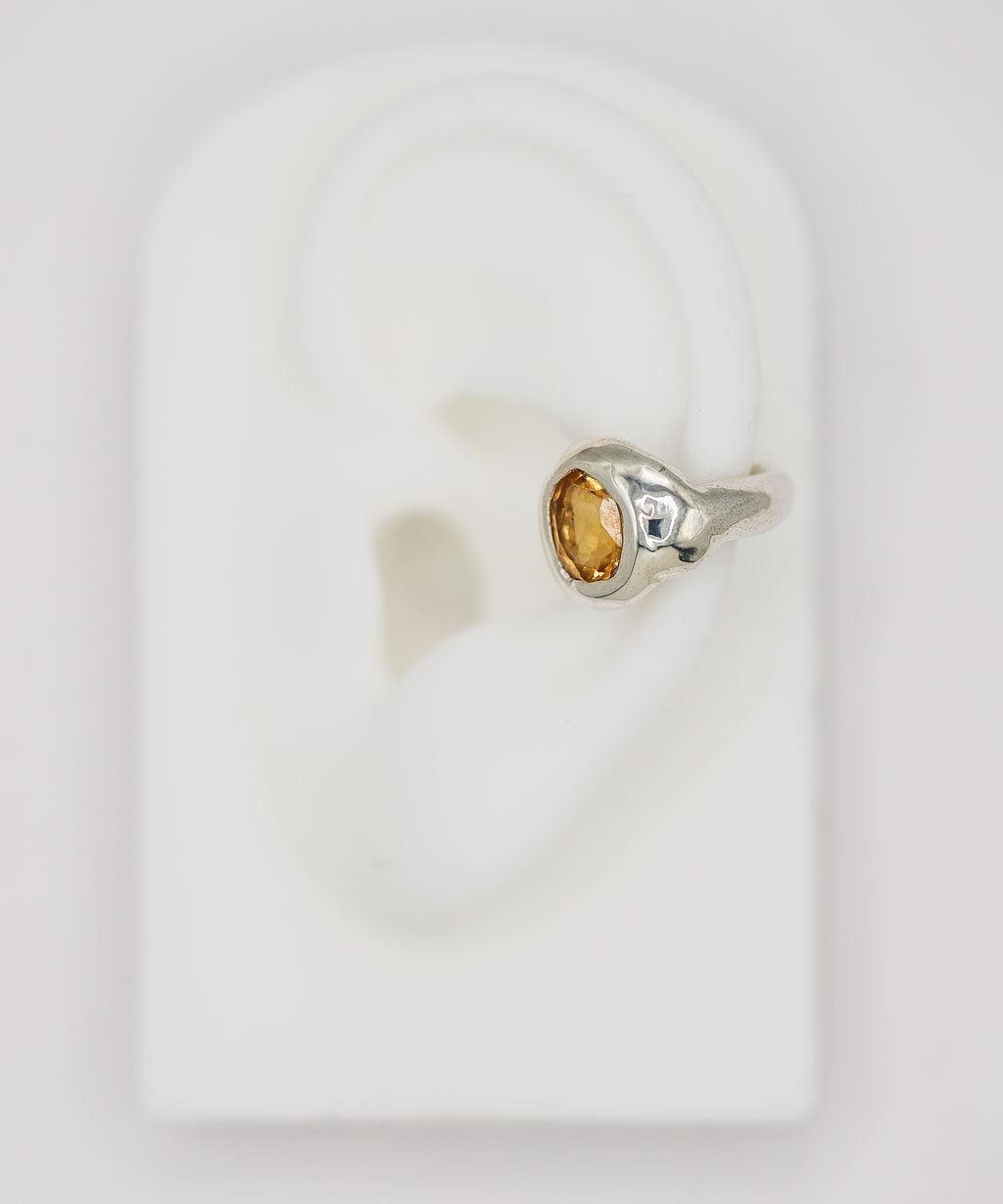 citrine and silver ear cuff on silicone ear