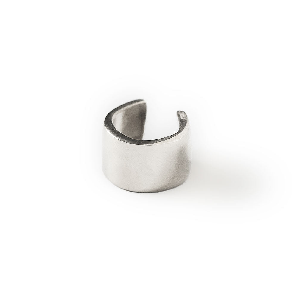 silver wide cartilage hug hoop on white background