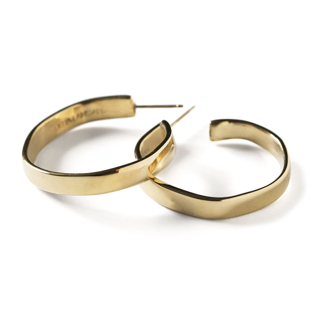 side view of flat medium sized gold hoop earring