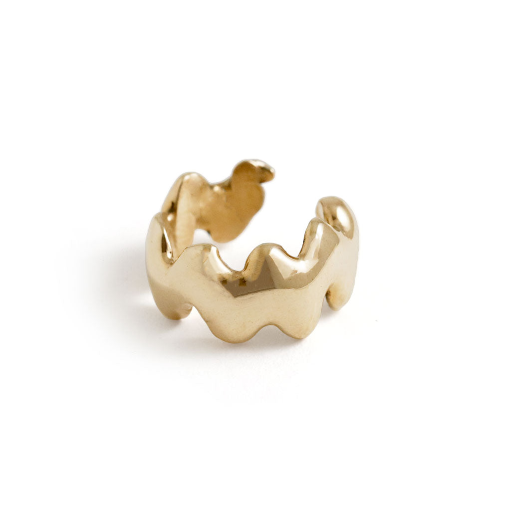 wavy gold cartilage hug hoop on gray background