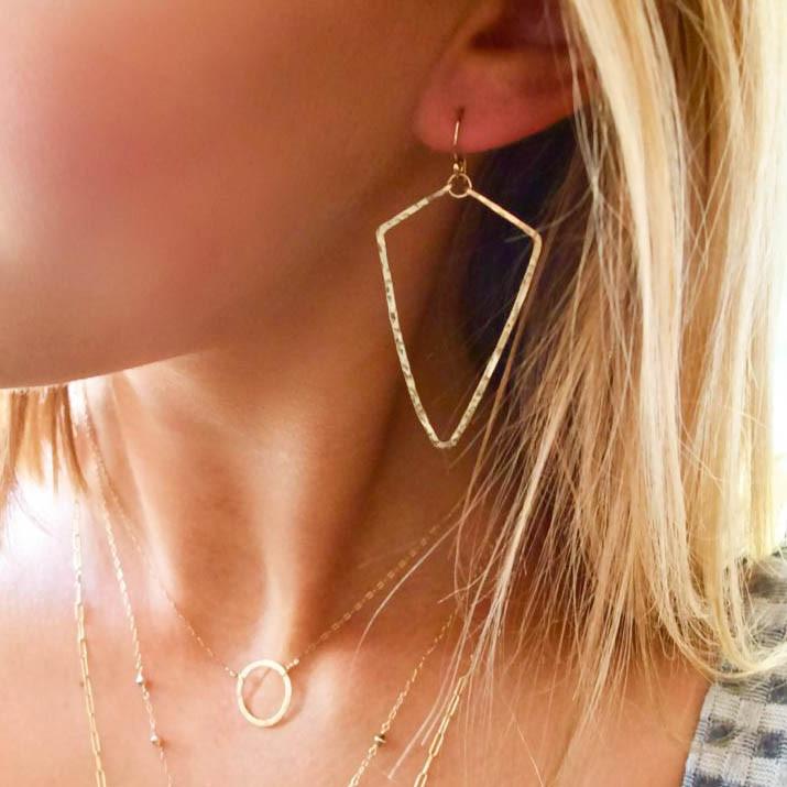 gold arrowhead earrings delicate geometric hammered earrings by delia langan jewelry