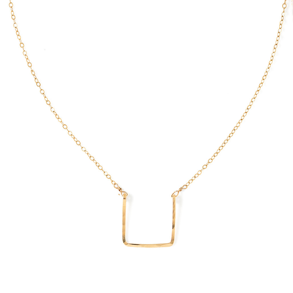 14k gold filled brick necklace on a white surface