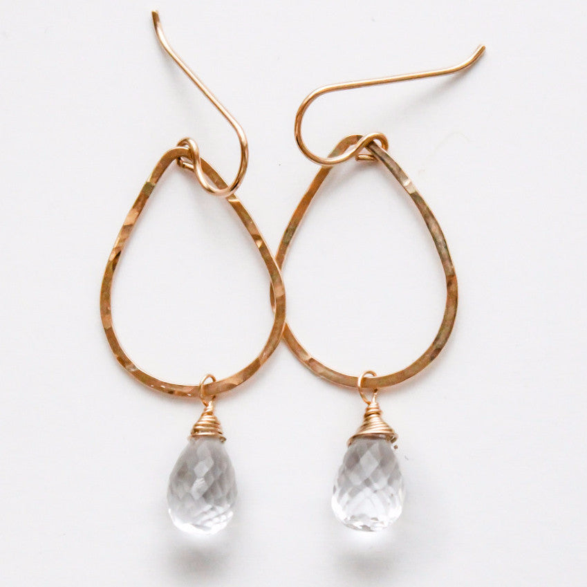 14k gold filled crystal quartz gemstone teardrop hoops on a white surface