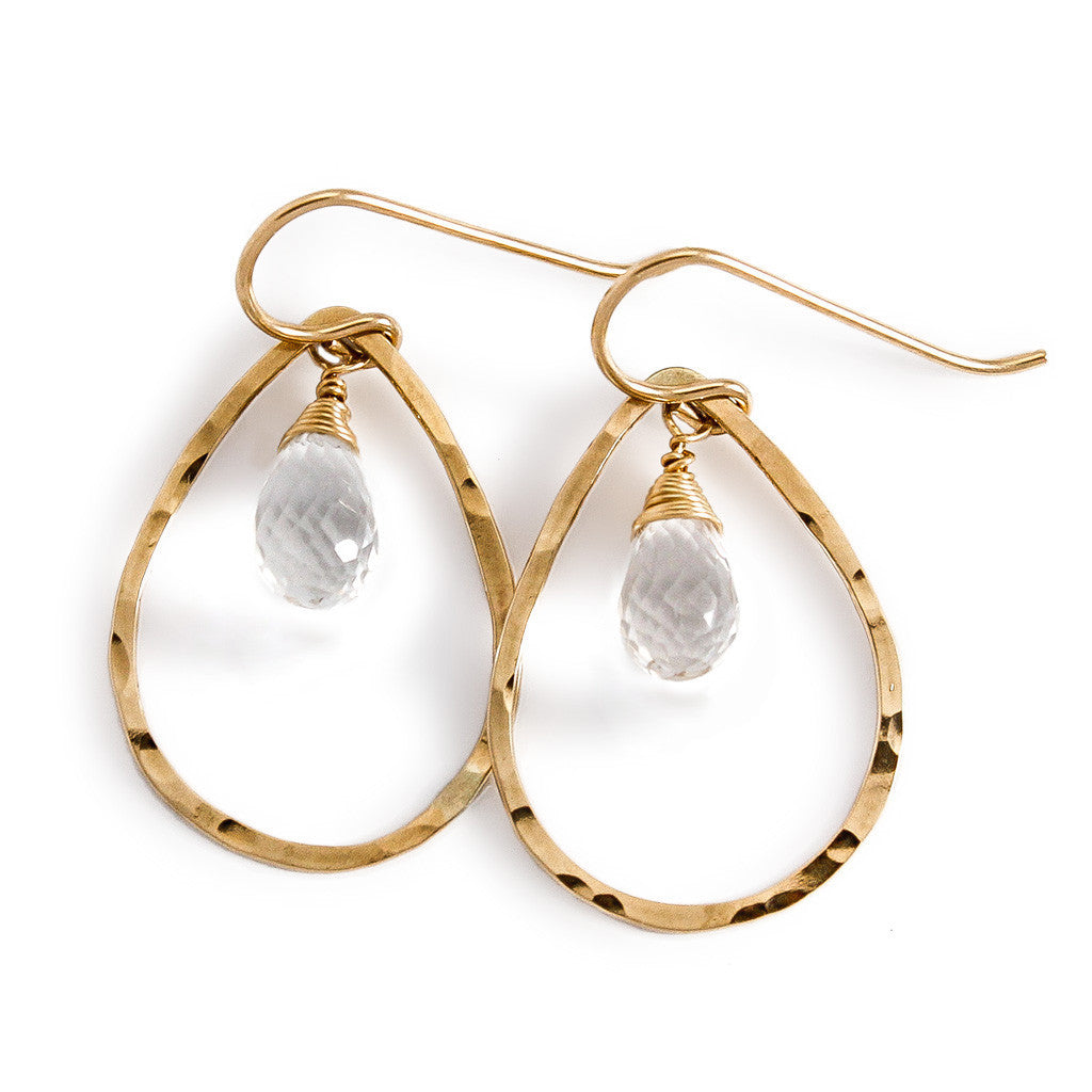 14k gold filled crystal quartz teardrop gemstone hoops on a white surface