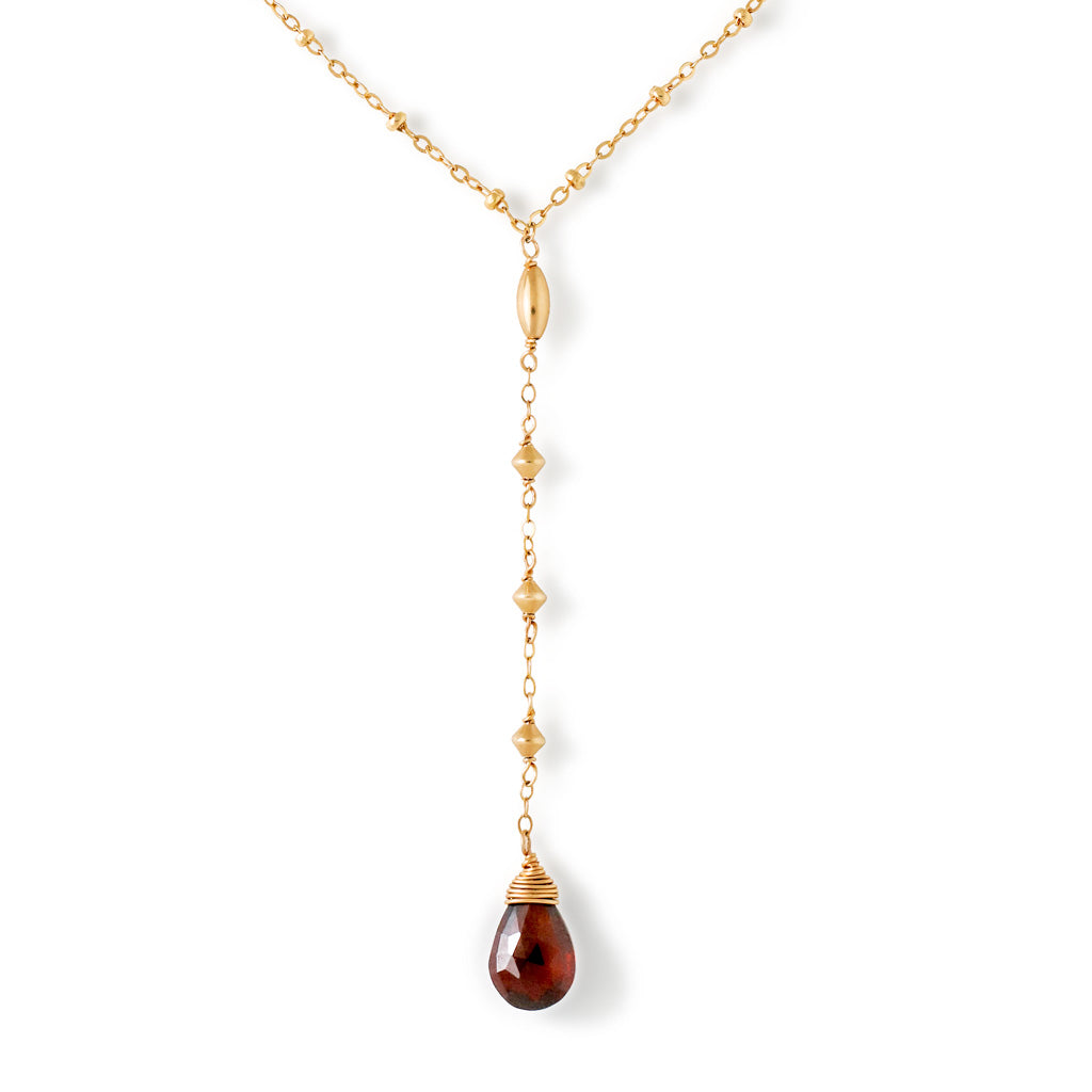 garnet y gemstone 14k gold filled necklace close up on white background