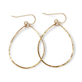 14k gold filled hoops for nuns hoop earrings on a white surface