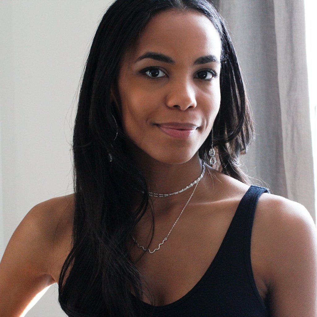 black woman on a black tank looking at camera wearing a sterling silver im hammered necklace