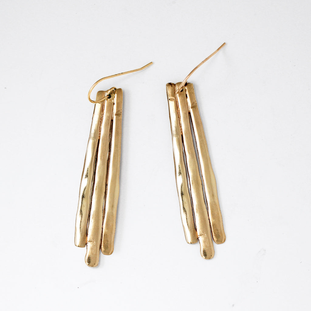 brass with sterling silver posts long fringe post on white surface