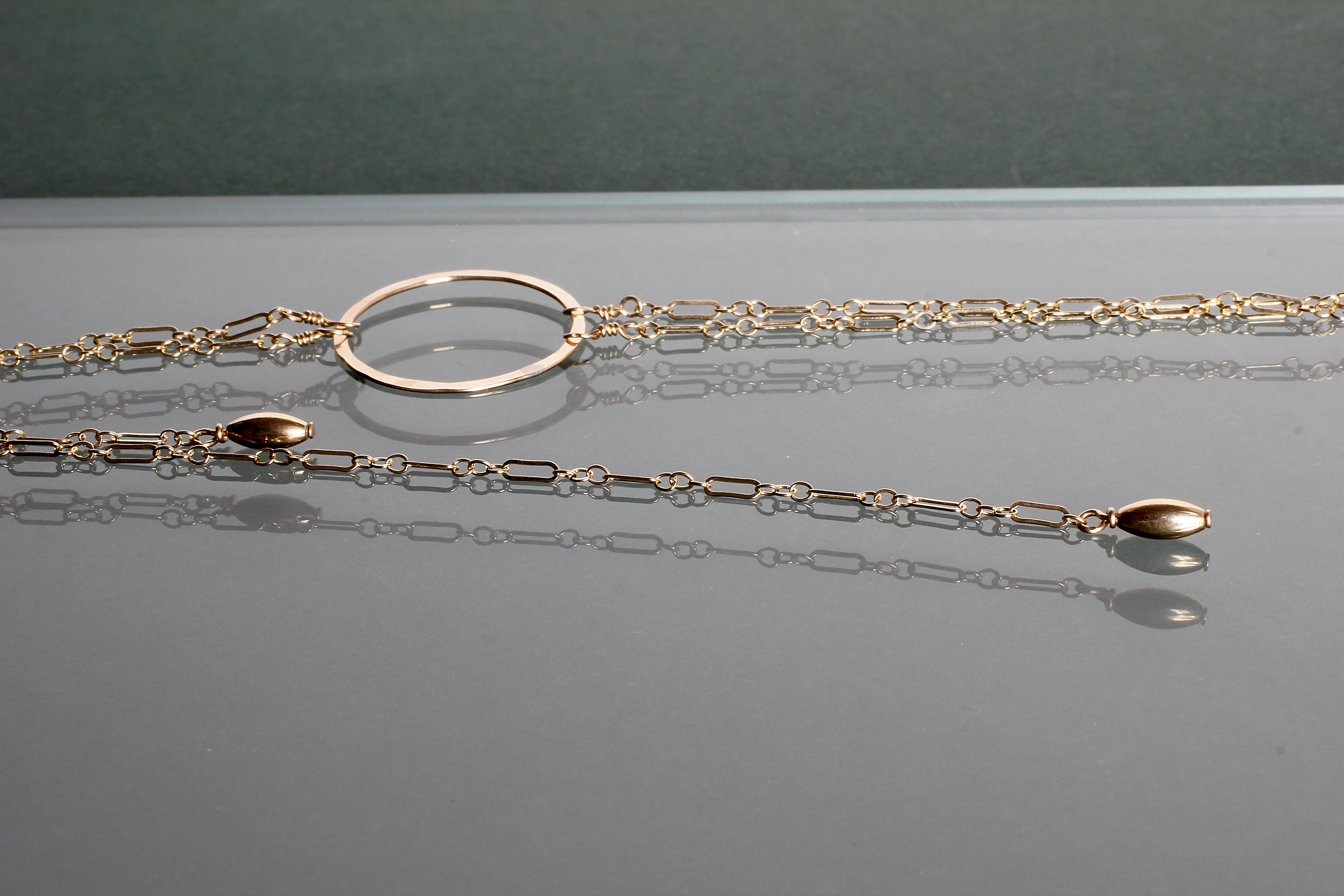 closeup view of medium gold bolo necklace y shaped necklace by delia langan jewelry
