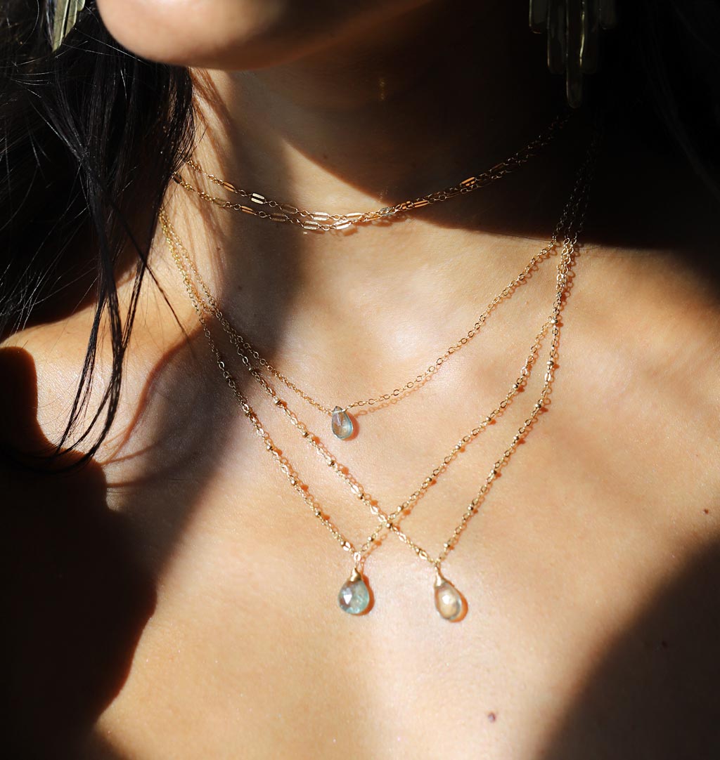 layered blue and green gemstone pendants with moss aquamarine and green amethyst