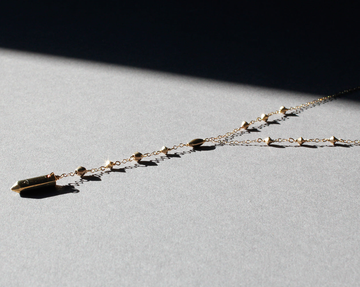 long gold y shaped pendant necklace