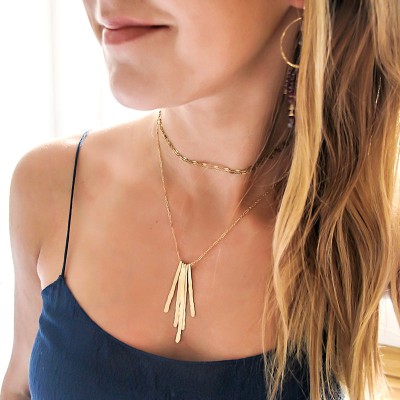 rays pendant gold fringe necklace and gold choker layering necklaces by delia langan jewelry