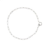 sterling silver small link chain bracelet on white surface