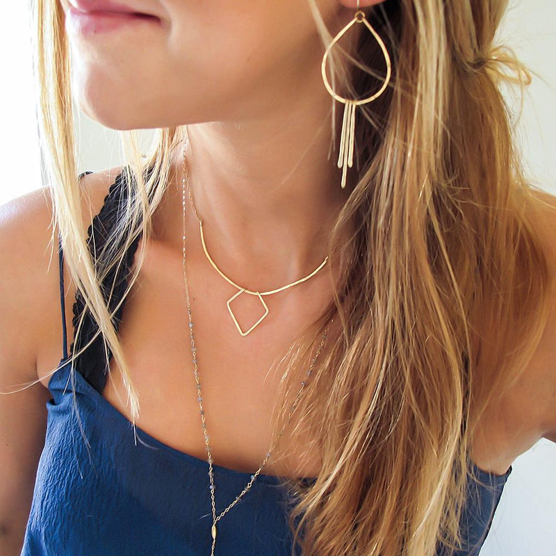 small teardrop fringe earrings with layered necklaces by delia langan jewelry