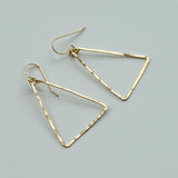 delicate gold triangle earrings by delia langan jewelry