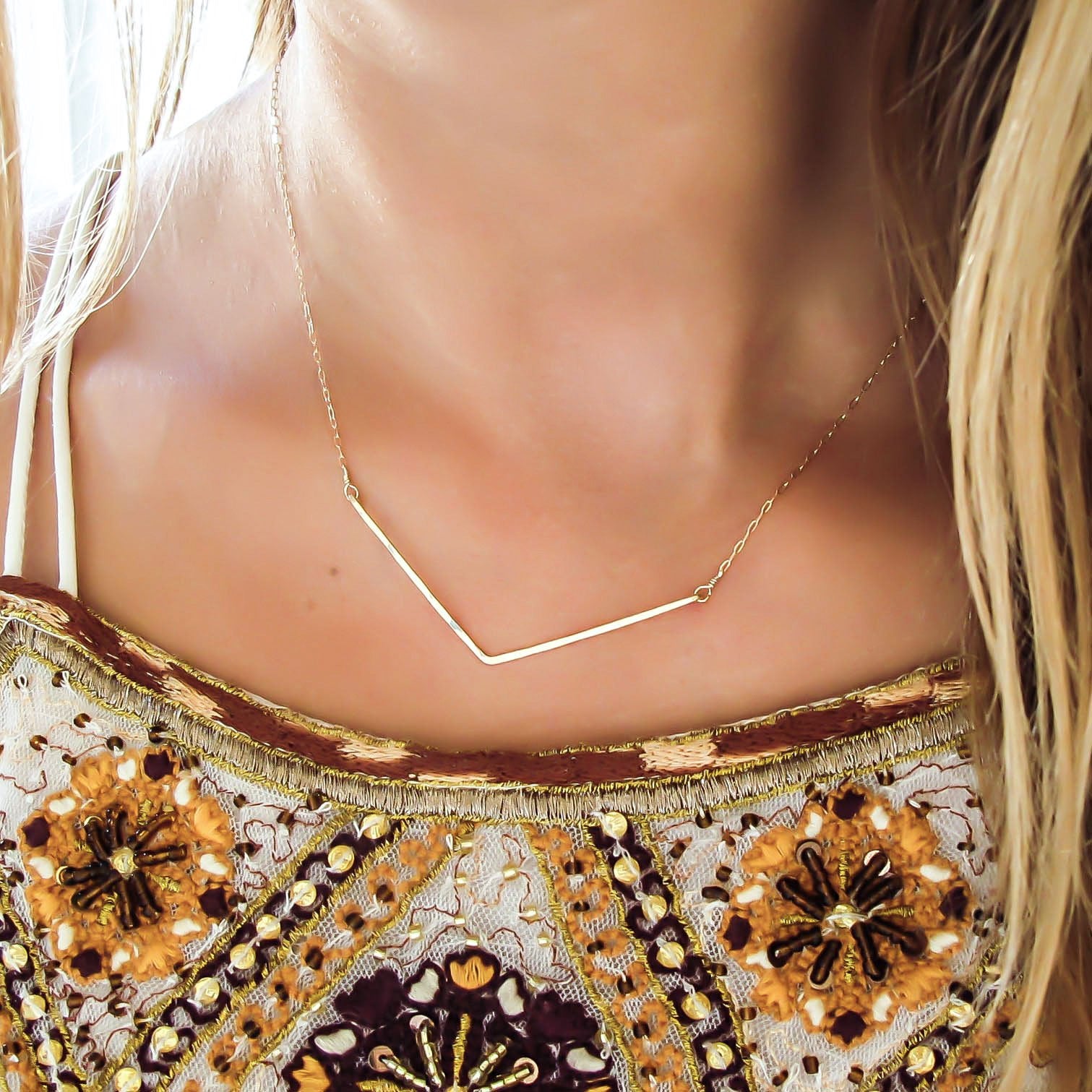 delicate gold hammered chevron v shaped necklace handmade by delia langan jewelry