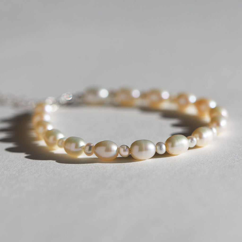 close up of creamy white alternating pearl bracelet