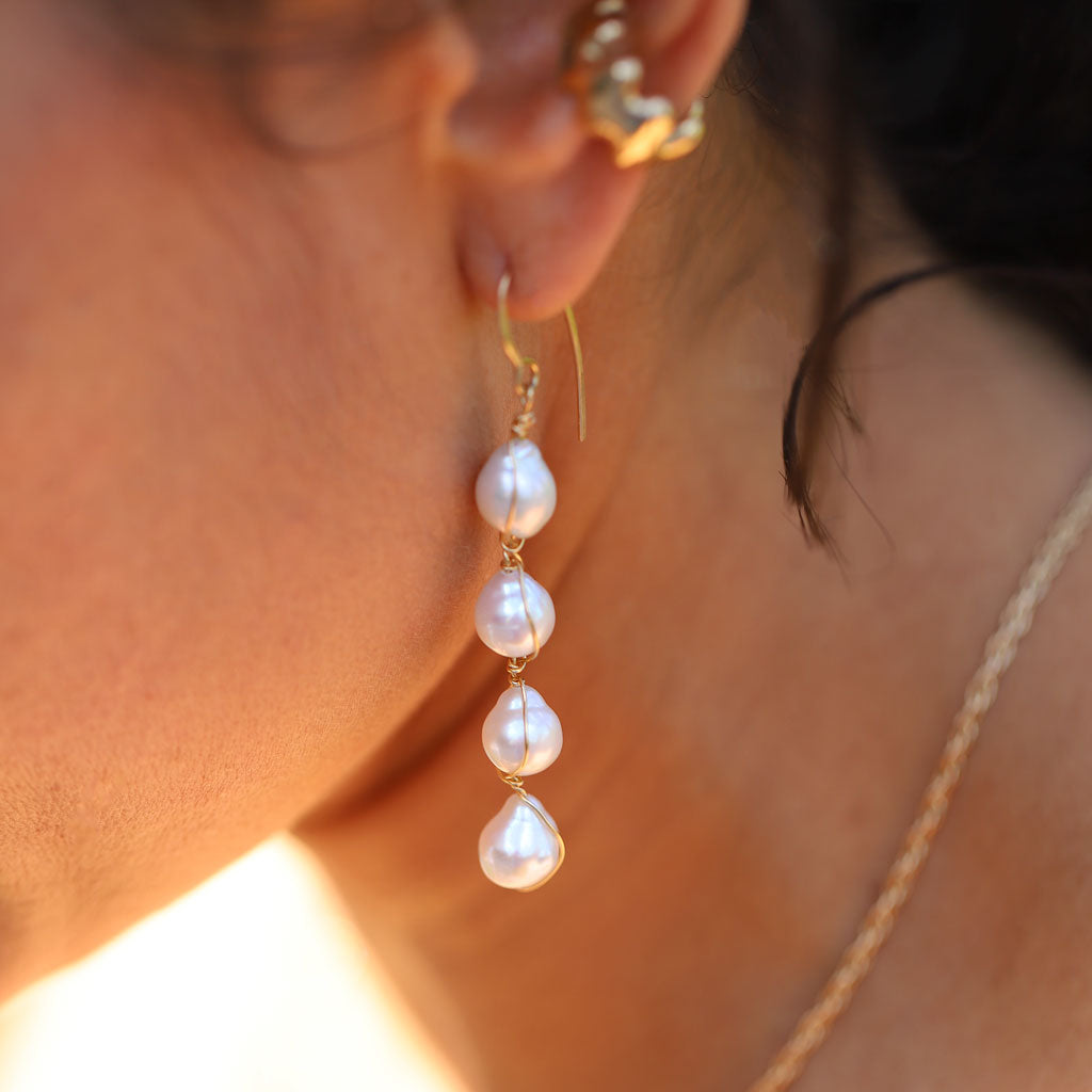 photo of four pearl wire wrapped drop earrings on ear