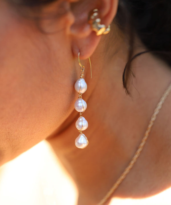 photo of four pearl wire wrapped drop earrings on ear