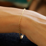 wrist with gold rope chain bracelet