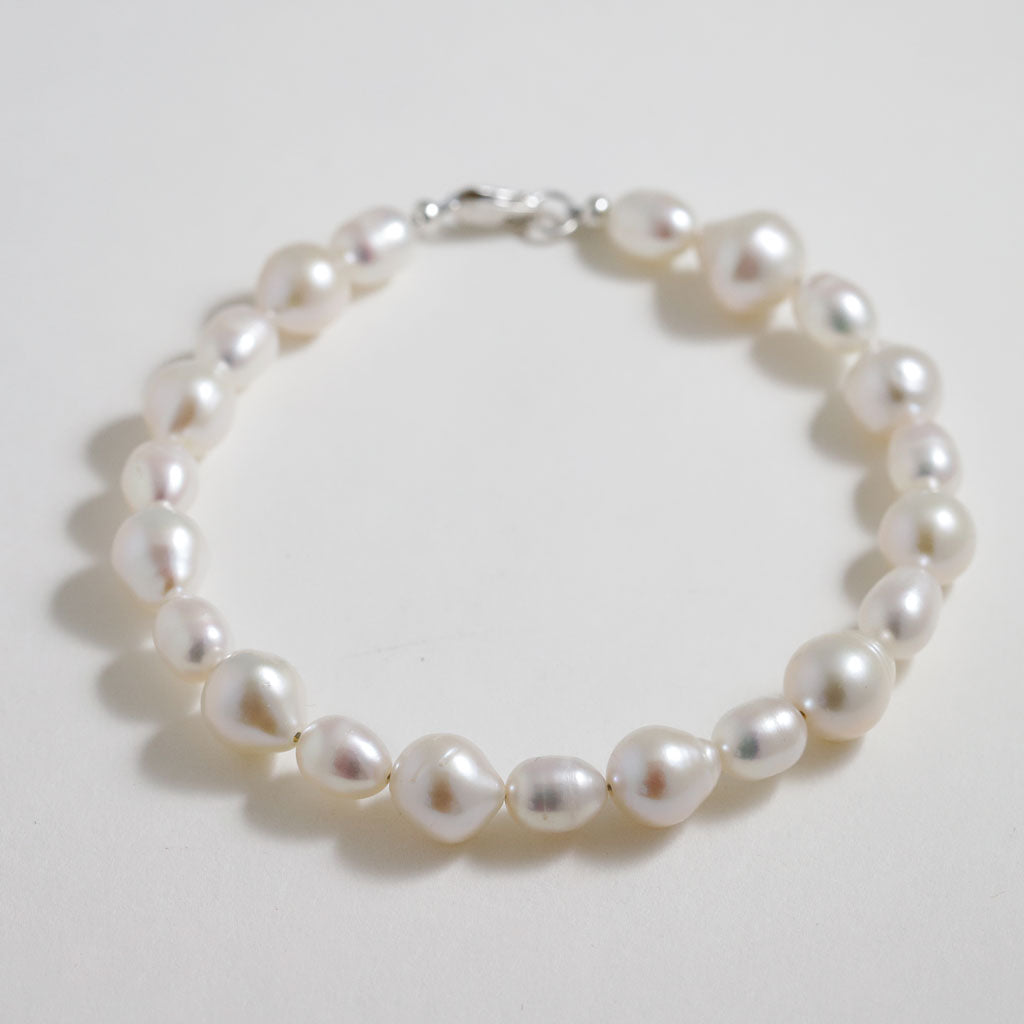 slightly irregular white pearl bracelet with silver clasp