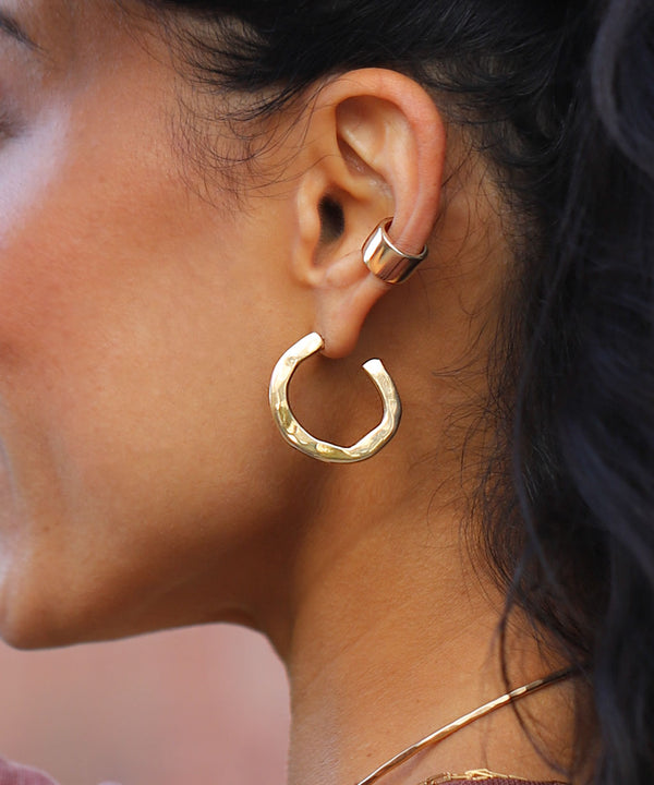 side view of ear with thick irregular gold hoop