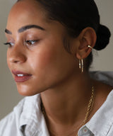 girl with layered gold hoops