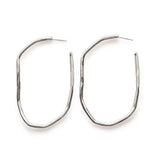 extra large irregular sterling silver long hoop earrings against white background