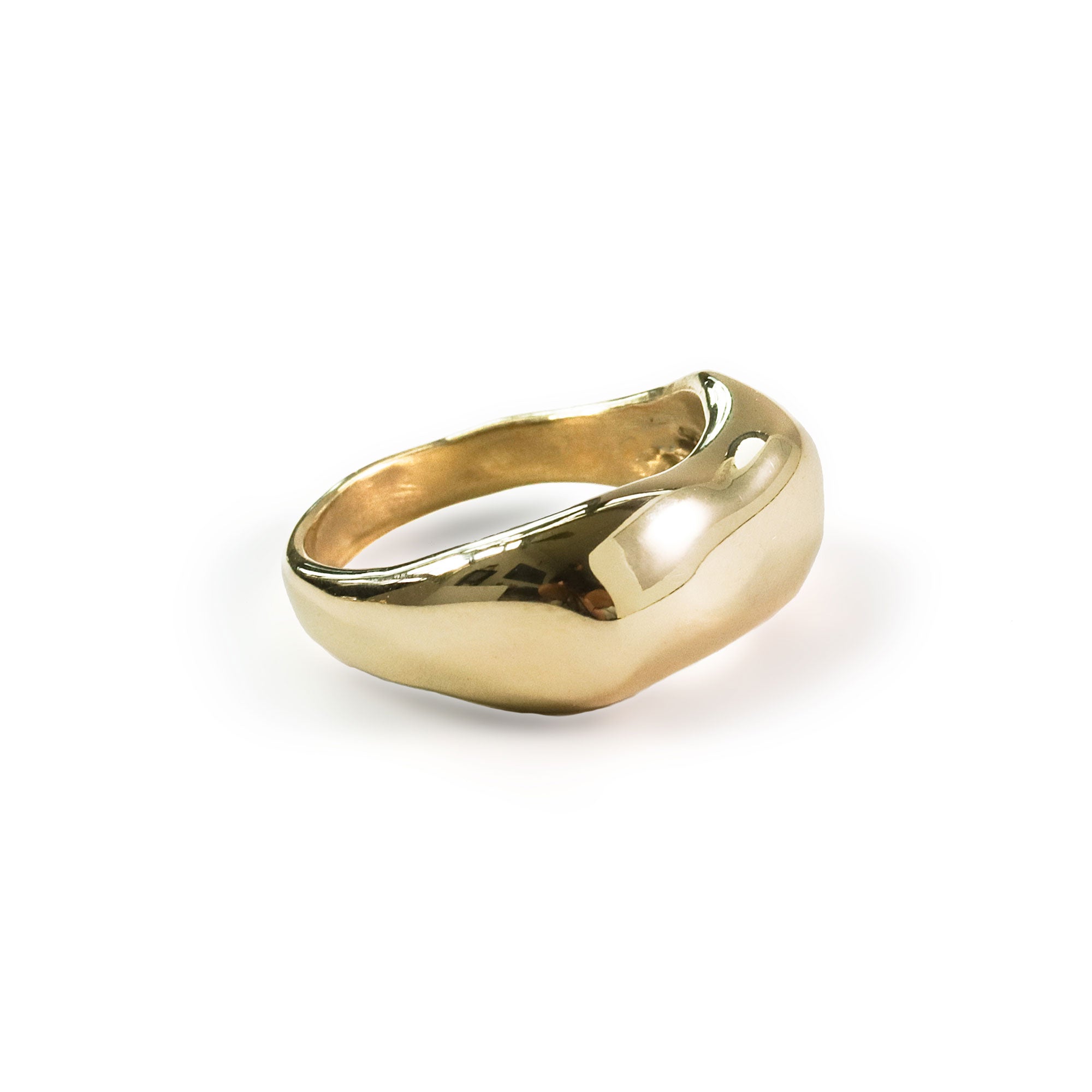 solid gold thick curved chunky ring on white background