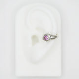 silver ear cuff with pink sapphire gemstone on fake ear
