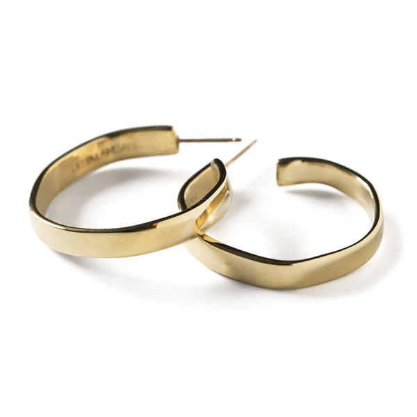 side view of flat medium sized gold hoop earring