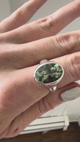 video of hand with green amethyst and silver ring