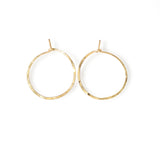 14k gold filled endless thin hoop earrings on white surface