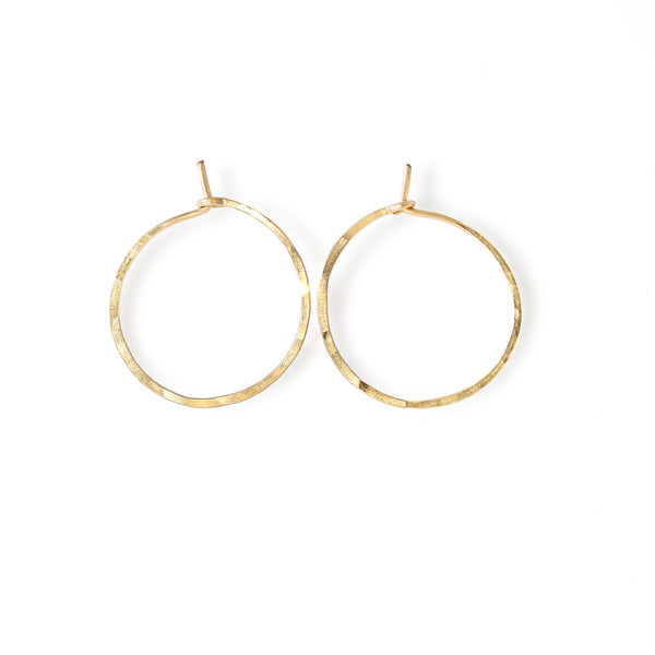 14k gold filled endless thin hoop earrings on white surface