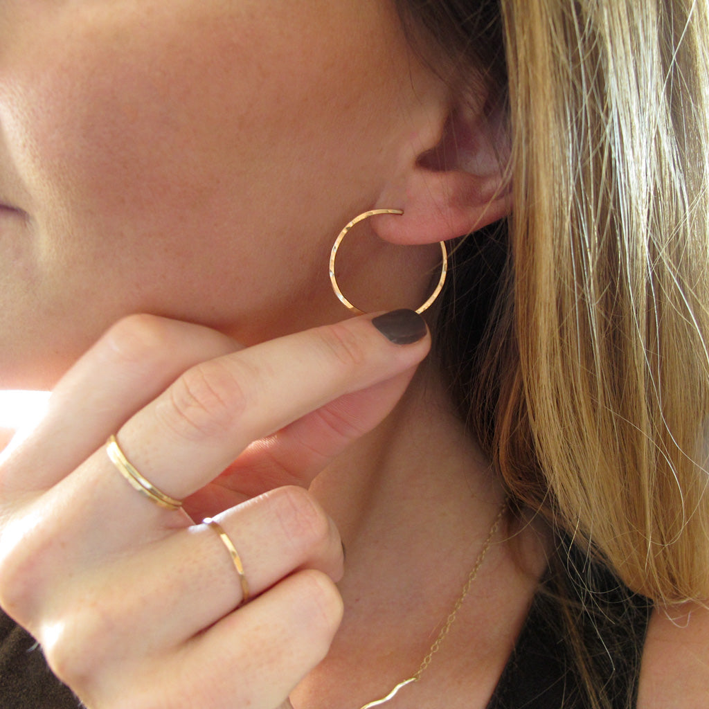 1" diameter thin gold hoop earrings on ear