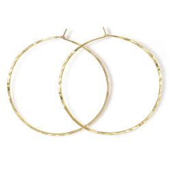 14k gold filled 2.5 inch endless thin hoop earrings on white surface