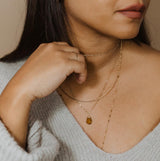 brunette woman wearing a 14k gold filled beer quartz gemstone beaded pendant 
