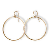 14k gold filled large round hoop earrings on a white surface 