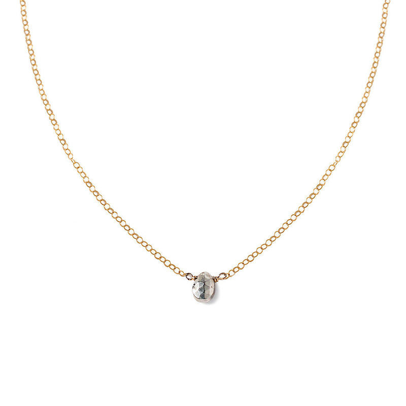 dainty silver pyrite necklace on delicate gold chain