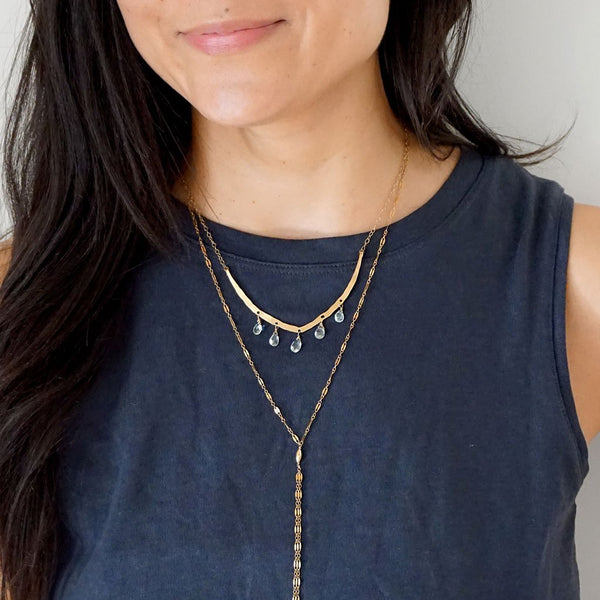 aquamarine flight necklace and gold sequin y necklace by delia langan jewelry