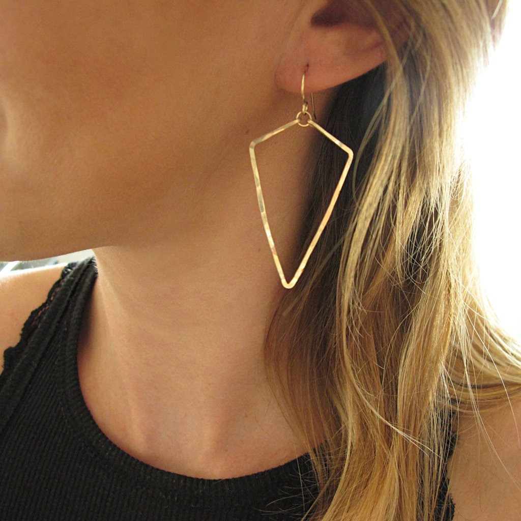 blond woman on a black tank wearing 14k gold filled arrowhead hoop earrings