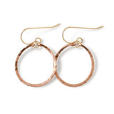 rose gold filled baby hoop earrings on a white surface