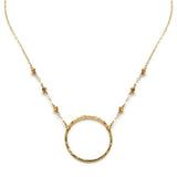 14k gold filled xl unity beaded necklace with a gold circle pendant on a white surface