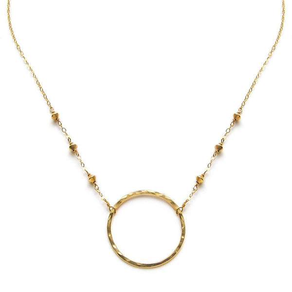 14k gold filled xl unity beaded necklace with a gold circle pendant on a white surface
