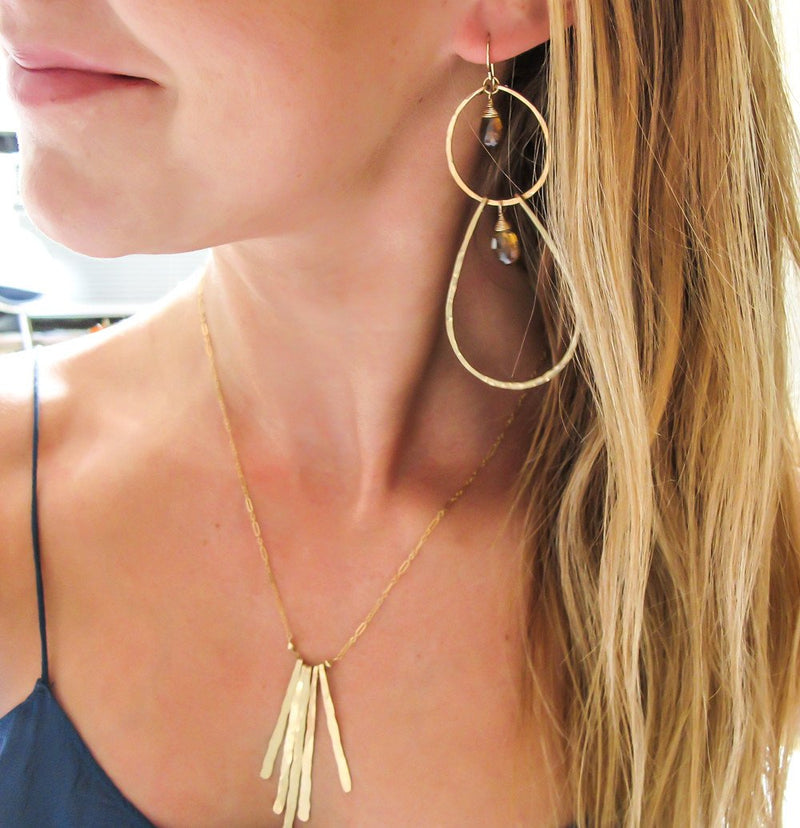 blond woman wearing 14k gold filled beer quartz double drop gemstone earrings