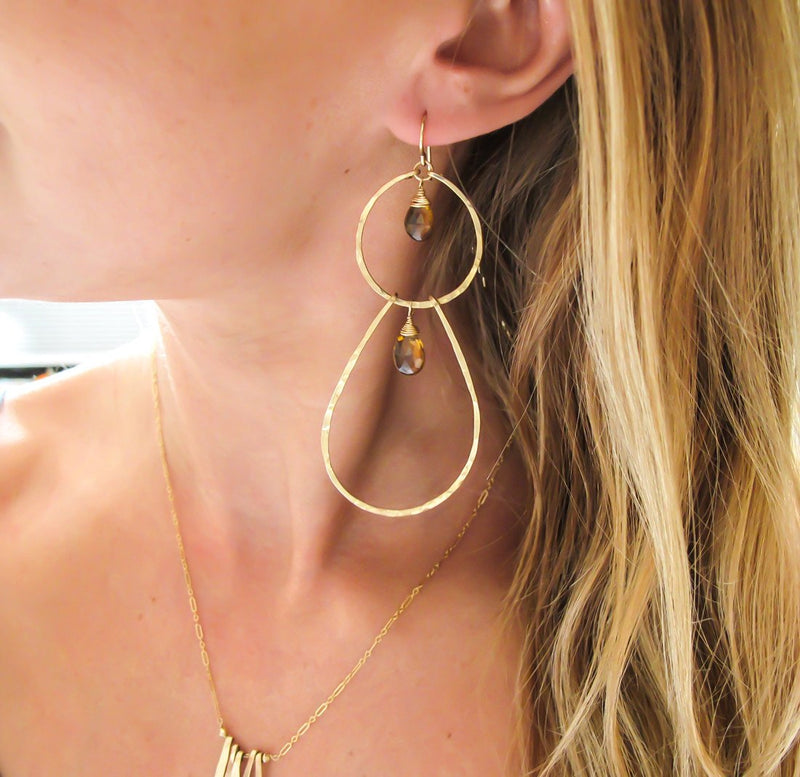 blond woman ear closeup wearing 14k gold filled beer quartz double drop gemstone earrings