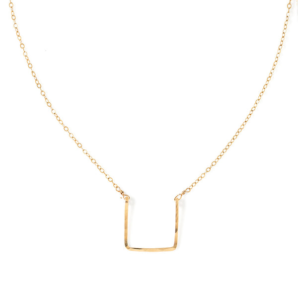 14k gold filled brick necklace on a white surface