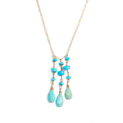 long turquoise necklace on gold chain by delia langan jewelry