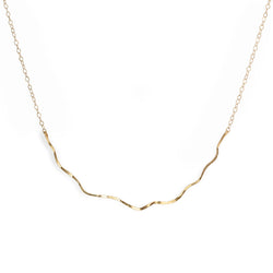 14k gold filled coastal route necklace on a white surface